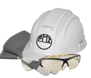 White hard hat with AMI logo, paired with gray safety gloves and protective goggles on a white background. 