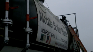 Industrial boiler equipment with a banner reading 'Mobile Boiler Plants' advertising services in Newport News, VA