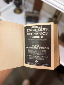Open vintage book showing the title page: Audels Engineers and Mechanics Guide 8.