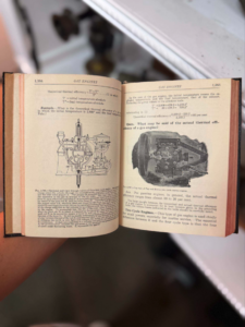 Open vintage technical book showing two engine diagrams with labeled pages titled 'Gas Engines'.