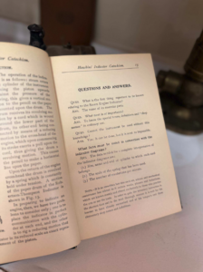 Open book showing a page titled 'Questions and Answers' about steam engine indicators; left page partially visible on the left side of the spread.