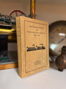 Dusty hardcover book: 'Steam Navigation in Virginia and Northern North Carolina Waters, 1826–1836' with a boat illustration on the cover.