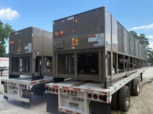 Large commercial HVAC unit on a flatbed trailer outdoors, YORK branding visible.