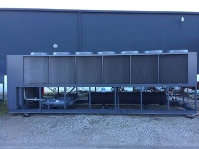 Used 300 ton Trane chiller in front of building