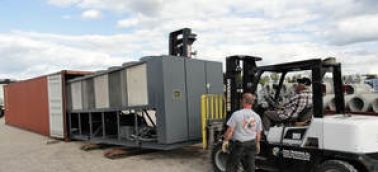 Refurbished used air cooled chiller installation at an ice rink