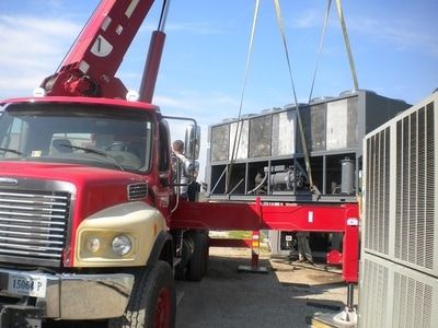 Used 215 ton Trane chiller being picked up by crane